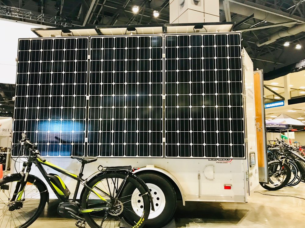 Charging electric bikes at the Seattle Bike Show with inside solar power!